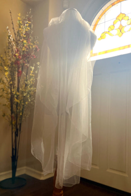 cascading bridal veil with ribbon edge on mannequin