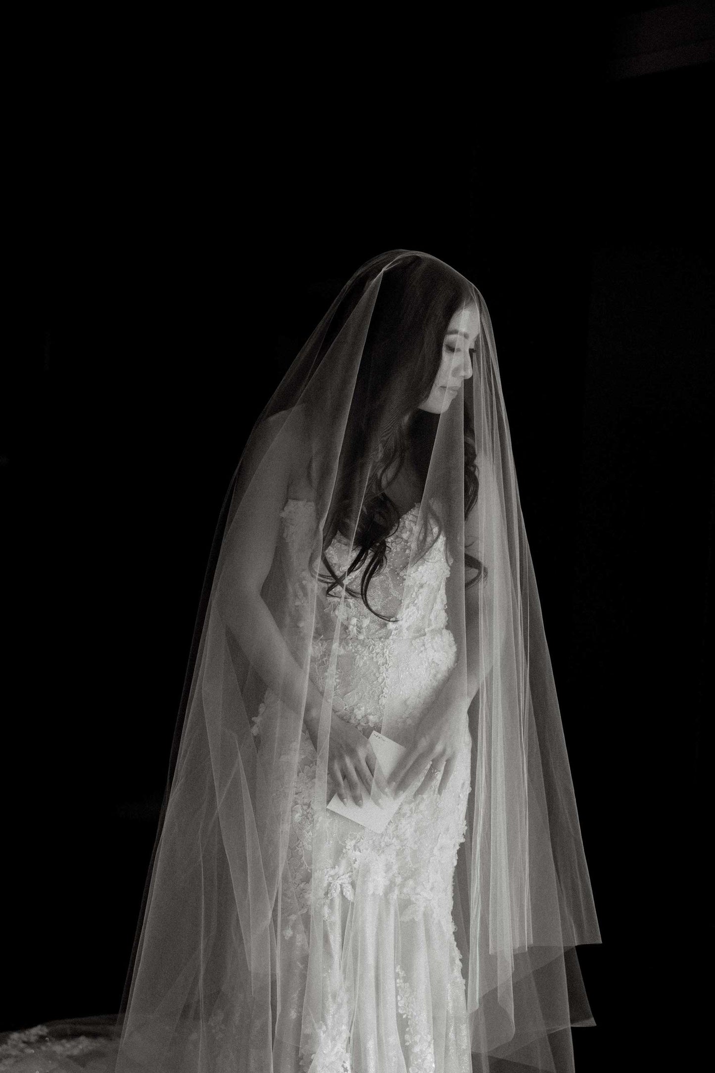 simple drop cut edge wedding veil with knee length blusher on bride with hair down